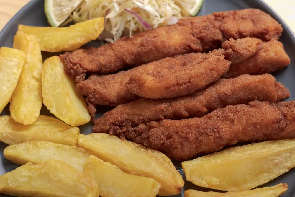 Crispy Lake Victoria fish fingers with golden chips in Entebbe Uganda